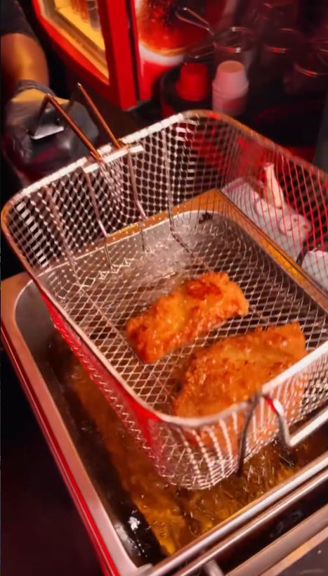 Crispy chicken frying in hot oil